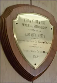  ??  ?? The plaque for the Vera C. Bryant Memorial Scholarshi­p that Raelyn Mertz received in 1963 to go to beauty school.