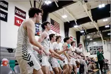  ?? PHOTO BY MARK STOCKWELL — BOSTON HERALD ?? Westwood High bench erupts during a boys basketball game against Hopkinton High at Westwood High School.