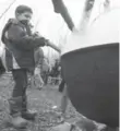  ??  ?? Abdullah Al Danh, 6, got a chance to stir sap boiling in a large pot.