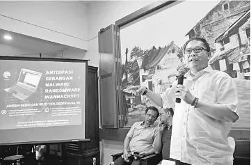  ??  ?? Rudiantara speaks to journalist­s during a press conference about the recent cyber attack, at a cafe in Jakarta. — Reuters photo