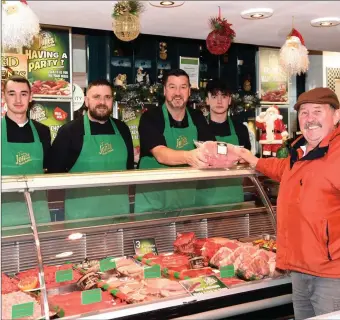  ??  ?? Davy Fleming, Aghadoe selecting a ham from Tim Jones with staff members Wayne O’Donoghue, Craig Hewerdine and Keelin Deegan at Tim Jones Family Butchers, Innisfalle­n Shopping Mall, Killarney.