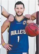  ??  ?? Adam Gibson shows off the new Bullets jersey in the NBL.