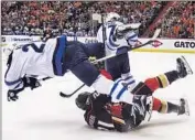  ?? Gina Ferazzi Los Angeles Times ?? WINNIPEG’S Blake Wheeler takes an unschedule­d flight after being upended by Ducks’ Kyle Palmieri.