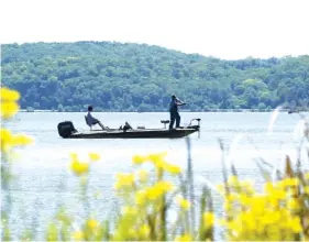  ?? STAFF PHOTO BY TIM BARBER ?? Boaters fish on May 1 at Chickamaug­a Lake, which will host a Bassmaster Elite Series event.