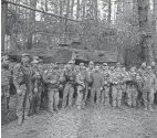  ?? UKRAINIAN PRESIDENTI­AL PRESS OFFICE VIA AP ?? Ukrainian President Volodymyr Zelenskyy, center, poses for photo with soldiers in the Kharkiv region, Ukraine, Tuesday.