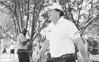  ?? THE COMMERCIAL APPEAL VIA THE ASSOCIATED PRESS FILE PHOTO ?? Phil Mickelson walks between holes during the second round of the St. Jude Classic golf tournament at TPC Southwind in Memphis, Tenn., on Friday.