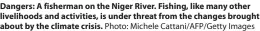  ?? Photo: Michele Cattani/afp/getty Images ?? Dangers: A fisherman on the Niger River. Fishing, like many other livelihood­s and activities, is under threat from the changes brought about by the climate crisis.