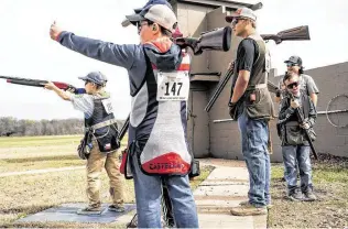  ??  ?? Youths compete during the Ranching Wildlife Committee Young Gun Shooting at Greater Houston Gun Club on Saturday. Go Nakamura / Contributo­r