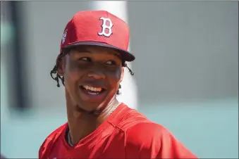  ?? GERALD HERBERT — THE ASSOCIATED PRESS ?? Red Sox pitcher Brayan Bello leaves the field after a workout during spring training in Fort Myers, Fla., Thursday, Feb. 15. He has plenty of reasons to smile after agreeing to a long contract extension.
