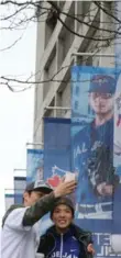  ?? STEVE RUSSELL/TORONTO STAR FILE PHOTO ?? Fans take a selfie outside Rogers Centre in October. Many of the early changes Mark Shapiro has made as president of the Blue Jays have focused on areas many fans may not realize exist.