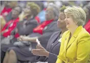  ?? Wendy Spencer, CEO of the Corporatio­n for National Community Service, the federal agency that administer­s AmeriCorps and Senior Corps, laughs during a ceremony to honor volunteers. ??