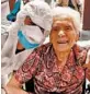  ?? RESIDENZA MARIA GRAZIA LESSONA ?? Ada Zanusso, 103, poses April 1 with a masked and gowned nurse after recovering from COVID-19 in Lessona, Italy.