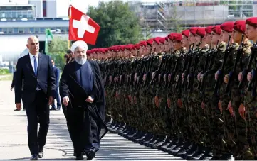  ?? (Reuters) ?? IRANIAN PRESIDENT Hassan Rouhani is welcomed by Swiss President Alain Berset yesterday upon his arrival for an official visit to Switzerlan­d.