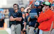  ?? [PHOTO BY BRYAN TERRY, THE OKLAHOMAN] ?? When it comes to the Cowboys, wildness rules. Somehow, Mike Gundy manages to stay calm amid it all.