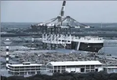  ?? AFP ?? A view of the Hambantota port. Sri Lanka on July 25 approved the sale of a 70% stake in the lossmaking but strategica­llyplaced deep sea harbour to China for $1.12 billion