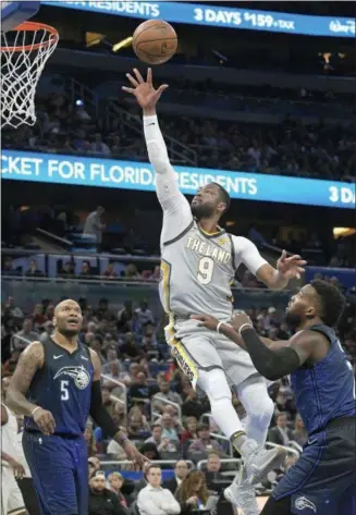  ?? THE ASSOCIATED PRESS ?? FILE - In this Feb. 6, 2018, file photo, Cleveland Cavaliers guard Dwyane Wade (9) puts up a shot between Orlando Magic forward Marreese Speights (5) and guard Shelvin Mack (7) during the first half, in Orlando, Fla. The Cavaliers dealt 36-year-old...