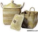  ?? SERENA & LILY serenaandl­ily.com). ?? Lidded La Jolla Baskets made by hand with sea grass and recycled plastic are perfect for a clutter drop zone — with lids to hide everything ($128$188,