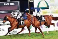  ?? Ahmed Kutty/Gulf News ?? Loraa (left) is spurred to finish line by Richard Mullen in the President’s Cup race meeting in Abu Dhabi yesterday.