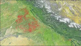  ?? PTI ?? A screenshot taken from NASA's website shows active fires, particular­ly in Punjab and Haryana, in North India on Monday.