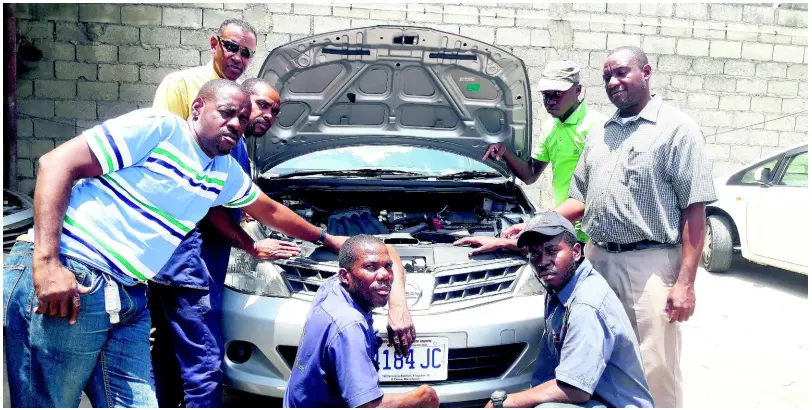  ??  ?? The men at Wheels and Wheels are always working hard to ensure that their customers are satisfied: (from left) Kevin Webster, Howard Gray, Oral Campbell, Wayne Miller, Tavaun Banner, Marlon Copeland, that and Jerome Porter.