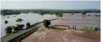  ?? SUBMITTED PHOTO ?? Photos taken by drone show the extent of flood damage along the Arkansas River this summer.