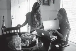  ?? PETE KIEHART/THE NEW YORK TIMES ?? Shekinah Lennon and her sister, Orlandria, try to connect to an online science class Oct. 29 from their home in rural Orrum, North Carolina.