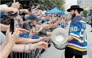  ?? ASSOCIATED PRESS FILE PHOTO ?? At 28, Ryan O’Reilly has won the Selke Trophy and Conn Smythe. His colleagues in the NHL know how good he is, but perhaps not all the fans. Above, he shares the Stanley Cup in St. Louis.