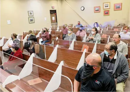  ?? Photos by Jerry Lara / Staff photograph­er ?? People wait to settle their debt cases in a Bexar County justice of the peace court on March 24.