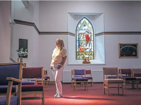  ??  ?? LET THERE BE LIGHT: The Rev Barbara Ann Sweetin in the renovated East and Old Parish Church in Forfar.