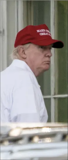  ?? PHOTO/ANDREW HARNIK ?? President Donald Trump arrives to the North Lawn of White House in Washington on Sunday after playing golf at Trump National Golf Club in Sterling, Va. AP