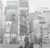  ?? NORIKO HAYASHI/THE NEW YORK TIMES ?? The anime industry’s boom has widened the gap between profits and wages. Above, Tokyo’s Akihabara district, a center of anime culture.