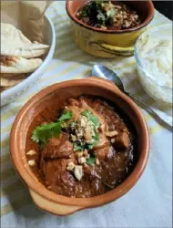  ?? Gretchen McKay/Post-Gazette ?? Chicken korma, a moderately spiced yogurt-based curry, is a popular dish in Pakistani cuisine.