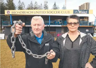  ?? Picture: GLENN HAMPSON ?? Broadbeach United Soccer Club president Michael Doyle and secretary Ren Shennan have tried extra chains and padlocks to deter thieves and vandals, to no avail.