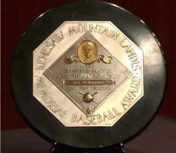  ?? AP Photo/Jennifer Szymaszek, File ?? In this 2006 file photo,a Joe DiMaggio 1947 MVP Award Plaque is displayed at a news conference in New York. The plaque features the name and image of Kenesaw Mountain Landis.