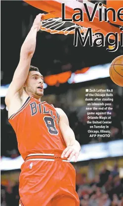  ?? Zach LaVine No. 8 of the Chicago Bulls dunks after stealing an inbounds pass near the end of the game against the Orlando Magic at the United Center on Tuesday in Chicago, Illinois. AFP PHOTO ??