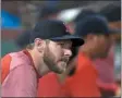  ?? STAFF PHOTO BY CHRISTOPHE­R EVANS/ MEDIANEWS GROUP/BOSTON HERALD ?? BOSTON, MA - AUGUST 20: Injured Red Sox pitcher Chris Sale watches from the dugout as Boston takes on the Philadelph­ia Phillies during the third inning of a Major League Baseball game at Fenway Park in Boston on August 20, 2019.