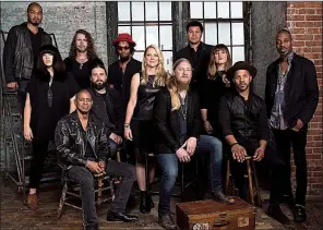  ??  ?? The Tedeschi Trucks Band, led by Susan Tedeschi (center, standing) and her husband, Derek Trucks (center, seated), will play at Robinson Center Performanc­e Hall in Little Rock on Sunday.