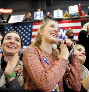  ?? AP/ MATT ROURKE ?? Attendees listen as Hillary Clinton speaks Monday at Manchester Community College in New Hampshire. The Democratic presidenti­al candidate is getting campaign help in New Hampshire from supporters known as the Arkansas Travelers.