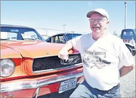  ?? KEVIN ADSHADE/THE NEWS ?? Philip Hughes and his 1966 Mustang.
