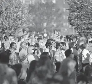  ?? SEAN RAYFORD/ AP ?? A crowd of people participat­ed in a memorial service and prayer vigil for the Lesslie family at Fountain Park in Rock Hill, North Carolina.