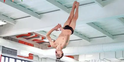  ?? CHRIS NIEVES/ROCKFORD REGISTER STAR ?? Freeport’s Tristan Peterson dives on Jan. 26, 2023, at Freeport High School in Freeport.