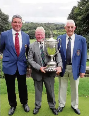  ??  ?? ●●From left: Tony Barnes (RV Captain), Andrew Rexstraw, Derek Wilson (RV President) with the Reddish Vale Trophy