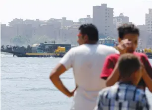  ?? (Amr Abdallah Dalsh/Reuters) ?? A FERRY overlookin­g the Nile island of al-Warraq in the south of Cairo in 2017.