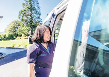  ?? ?? Above: Above: Hanna Lumbay preparing for a regular van outing.
Above left: Residents are able to enjoy the beautiful surroundin­gs at Leslie Groves Hospital.