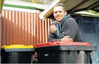  ?? Photo / George Novak ?? Kemble Cadwallade­r, 26, says the new council rubbish bin is too small.