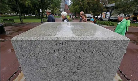  ?? STUART CAHILL / HERALD STAFF ?? ALL THAT’S LEFT: The pedestal that used to display a statue of Christophe­r Columbus sits empty in the North End’s Christophe­r Columbus Park. The statue was removed after the head was broken off several years ago.