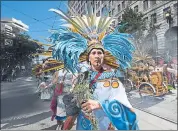  ??  ?? A protester marches Saturday in San Francisco. This week, the climate action summit in the city is expected to draw 4,000 delegates from six continents. The summit seeks deeper worldwide commitment­s to fighting climate change.