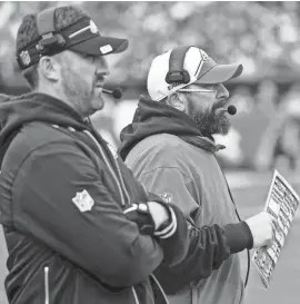  ?? AP ?? Eagles head coach Nick Sirianni, left, stands with senior defensive assistant Matt Patricia during the first half against the Arizona Cardinals on Dec. 31 in Philadelph­ia.