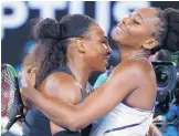  ?? DITA ALANGKARA/AP ?? Serena Williams, left, embraces her sister, Venus, after the two played for the Australian Open title, Serena won 6-4, 6-4 on Saturday night.