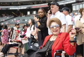  ?? ?? LEFT: Aida Pajarito, originally from the Philippine­s, waves an American flag.